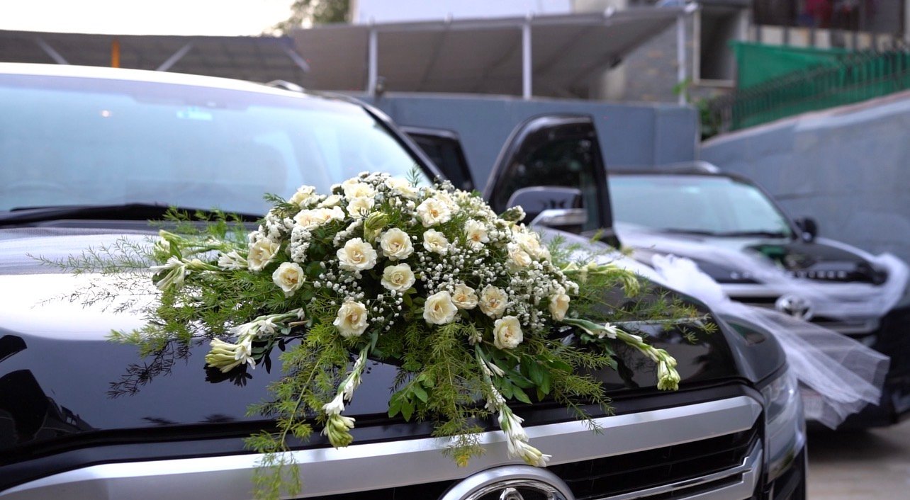 Black bridal wedding car parked outside marquee venue - Wedding car rental