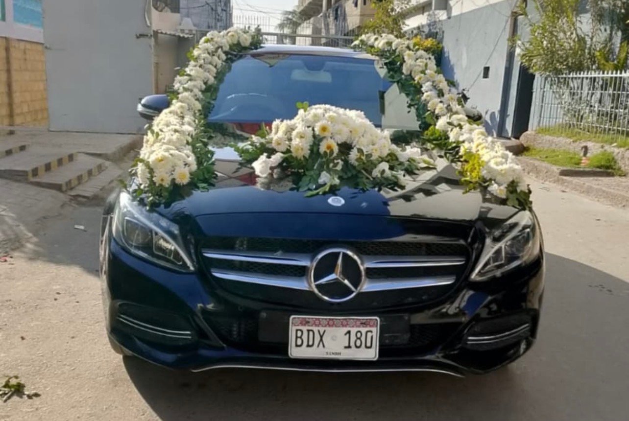Black executive sedan decorated for Barat entry - Wedding rent a car