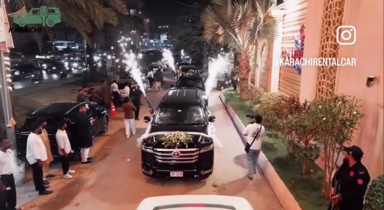 Black luxury SUVs for wedding car rental Karachi decorated with fresh floral arrangements